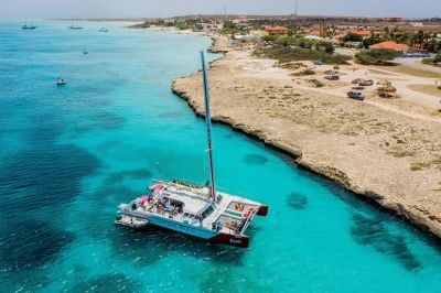Feel the sea breeze on aruba’s turquoise waters, snorkel at the antilla shipwreck, and enjoy a fresh caribbean lunch buffet—includes gear, open bar, and hotel pickup.