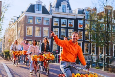 Feel the city’s rhythm on a guided amsterdam bike tour. cycle past canals, vondelpark, dam square & rijksmuseum. includes english-speaking guide & stroopwafel treat.