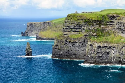 Feel the atlantic wind at the cliffs of moher, wander the burren’s wild rocks, and soak up galway’s music-filled streets on this full-day tour with guide and lunch stop.