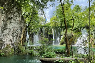 Step into the waterfalls of plitvice lakes and wander rastoke’s riverside mills on a full-day trip from zagreb. includes entry ticket, hotel pickup, and local guide.