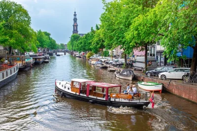 Float through amsterdam’s canals on a cozy electric boat, taste dutch snacks, sip drinks, and hear local stories from your captain. includes restroom & heated cabin.