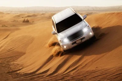 Feel the rush of dune bashing near dubai, watch sunset colors over the sand, try shisha, and enjoy a bbq dinner with dance shows. includes pickup from your hotel.