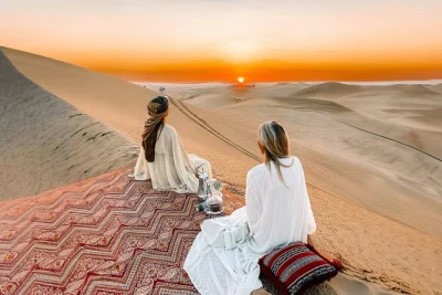 Watch the sunrise over abu dhabi’s dunes, sip arabic coffee on carpets, and enjoy a short camel ride. includes pickup and local guide for a smooth morning escape.