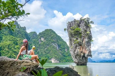 Glide by canoe through caves, visit james bond island, and swim in calm lagoons on a day trip from phuket with lunch, fruit, and hotel pickup included.