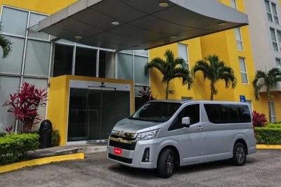 Step off your flight in san josé and spot your name at arrivals—private transfer with local welcome, air-conditioned comfort, and direct hotel drop-off included.