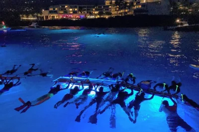 Watch the sunset in kona, snorkel with manta rays after dark, and relax on deck with snacks—includes all gear and local guides for a smooth night out.