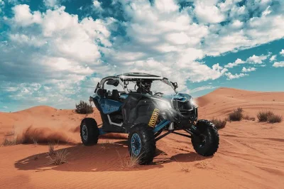 Feel the desert wind on a dubai buggy tour with hotel pickup, safety gear, and a friendly guide. drive a can-am maverick x3 through sand dunes and ancient trails.