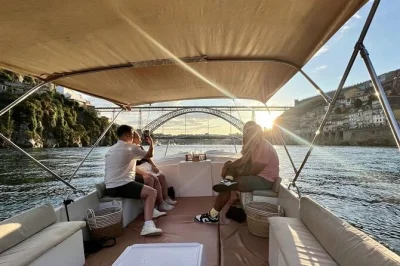 Float past porto’s bridges and cellars on a douro boat cruise, tasting three port wines with snacks. includes local guide, all fees, and bottled water.