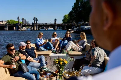 Float past amsterdam’s canal houses, anne frank house & skinny bridge on a 1-hour open boat cruise. includes live skipper commentary & unlimited drinks if chosen.