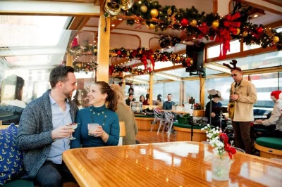 Step aboard a cozy new york city holiday cruise with live jazz, homemade cookies, spiked cocoa, and skyline views. includes assigned seating and a local guide.