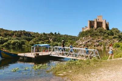 Step into portugal’s templar history on a day trip from lisbon. explore almourol castle by boat, wander tomar’s old streets, and tour the convent of christ with a guide. includes pickup.