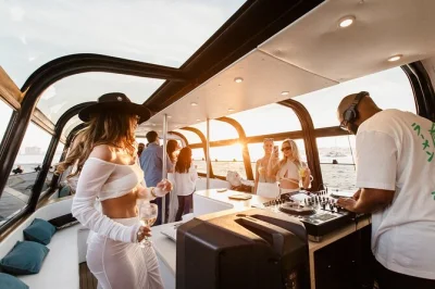 Feel the lisbon sunset from a luxury boat with live dj, unlimited pizza, and open bar as you cruise past city icons. includes pickup options and local guide.