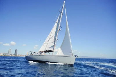 Set sail from marina badalona on a barcelona yacht cruise with open bar, snacks, and city skyline views. includes local captain, swim stop, and drinks on board.