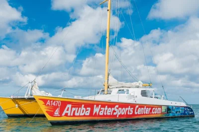Feel the sea breeze on a 65-foot catamaran in aruba, snorkel vibrant reefs, enjoy snacks and unlimited drinks, and relax with a friendly local crew. includes equipment.