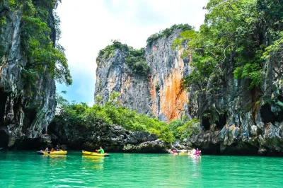 Start your phang nga bay adventure with sea cave canoeing, explore james bond island, enjoy a buffet lunch onboard, and relax with round-trip hotel pickup.