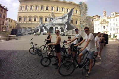 Feel the rhythm of rome on a small group e-bike tour—ride past the colosseum, circus maximus, and secret gardens with a local guide. includes bikes & helmets.