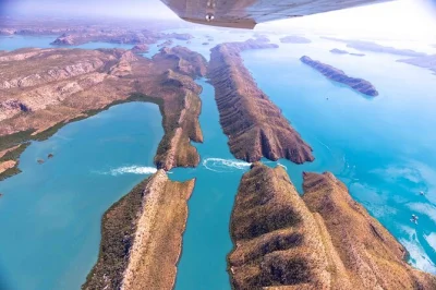 Feel the rush over horizontal falls, explore ancient buccaneer islands, tour cygnet bay pearl farm, and enjoy lunch with a swim—includes all fees and return flight.
