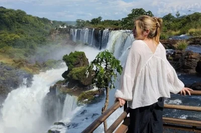 Feel the spray of iguassu falls from brazil & argentina in one day, with private transport, border assistance, and a local guide. includes hotel pickup.