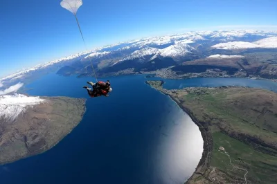 Feel the rush of a tandem skydive in queenstown, soar above the wakatipu basin, and glide back to earth with a local guide. includes pickup and all gear.