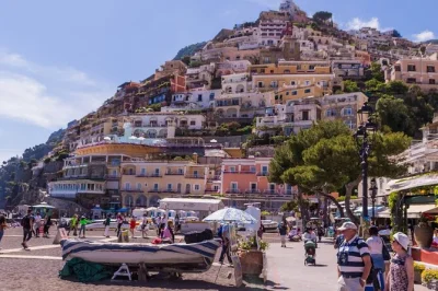 Feel ancient streets underfoot in pompeii, wander positano’s sunlit alleys, and sip limoncello on the amalfi coast—all with hotel pickup and a local guide.