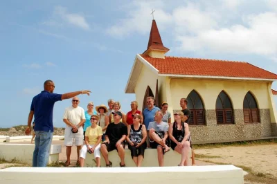 Feel aruba’s history on a guided island tour—see the california lighthouse, alto vista chapel, and bushiribana gold mill ruins. includes hotel pickup and ac bus.