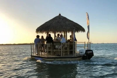 Float past clearwater beach homes and dolphins on a tiki boat, bring your own drinks, relax with a local captain, and enjoy music—includes cooler and ice.