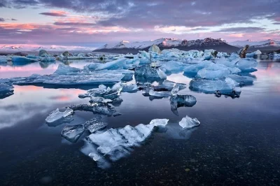 Feel the spray at seljalandsfoss, hike sólheimajökull glacier, and drift among icebergs at jökulsárlón lagoon. includes hotel pickup, boat tour, and breakfast.