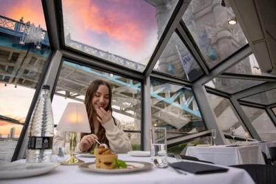 Feel london’s city lights drift by on a thames dinner cruise with live music, a 3-course meal, and vip seating upgrade. includes welcome drink and pickup location at westminster pier.