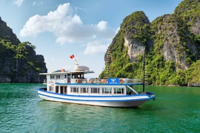 Feel the sea air on a halong bay day trip from hanoi with titop island hike, sung sot cave, kayaking, and lunch. includes pickup and sunset fruit party.