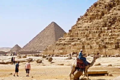 Fly from hurghada to cairo for a full-day tour. see the giza pyramids, sphinx, egyptian museum, old cairo, and shop at khan el khalili bazaar.