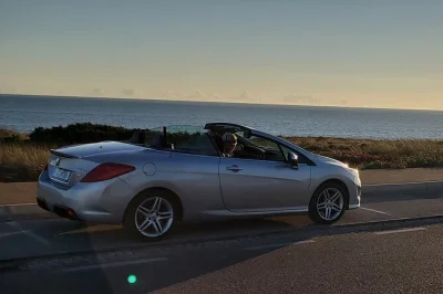 Drive portugal’s coast in a convertible, watch sunset at cabo da roca, sip pink bubbly with strawberries on guincho beach. romantic, scenic, unforgettable.
