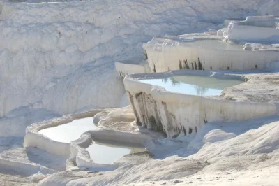 Explore pamukkale thermal pools and hierapolis on a small-group day trip from kusadasi. includes lunch, entrance fees, and expert local guide.