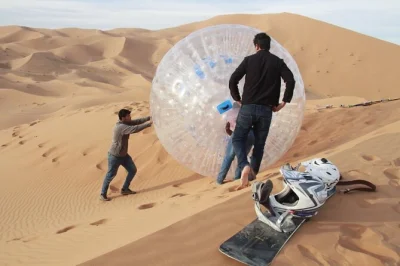 Try zorbing in merzouga’s erg chebbi dunes. roll down golden sand in a giant bubble—morocco’s first zorbing spot. private transport included.