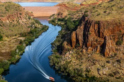 Feel the wild kimberley on a 110km ord river cruise from kununurra to lake argyle, with wildlife spotting, riverside afternoon tea, and sunset views. includes pickup.