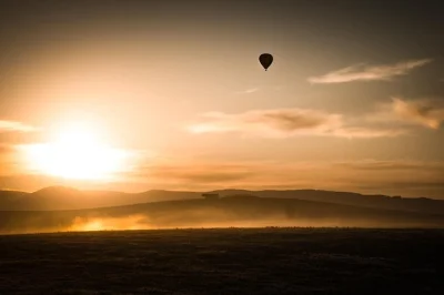 Float above yarra valley at sunrise in a hot air balloon, glide over vineyards, then relax with a champagne breakfast at racv healesville. includes private transport.