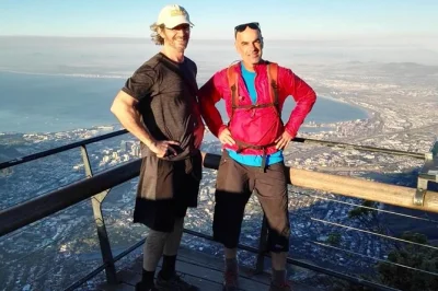 Watch cape town wake up from table mountain on a guided sunrise hike. includes snacks, bottled water, and hotel pickup. book your spot for early morning views.
