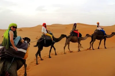 Journey from fez to merzouga’s sahara dunes, ride camels at sunset, and spend a night in a berber camp. includes pickup, meals, and local guide.