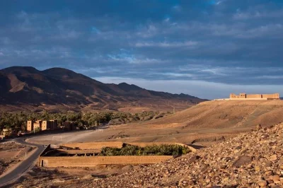 Private day trip from ouarzazate to zagora desert, draa valley, tinfou dunes. includes lunch, driver, hotel pickup. explore palm groves & ancient villages.