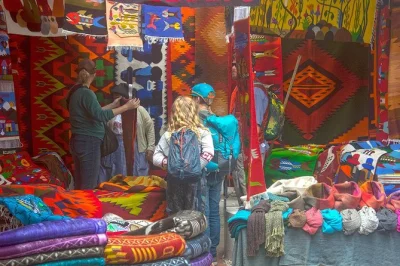 Explore otavalo market, cotacachi leather shops, and san antonio woodcarvers on a private day tour north of quito. hotel pickup, guide, lunch included.