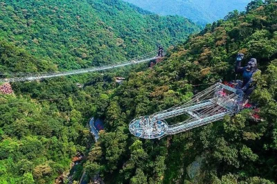 Walk the glass bridge at gulong gorge, see waterfalls, and explore jinlong cave’s underground river on a private day trip from guangzhou. includes pickup & lunch.