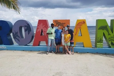 Feel the warmth of roatan with a private day tour—hold a sloth, taste fresh chocolate, browse local crafts, and relax at the beach. includes pickup and local guide.
