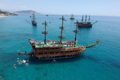 Set sail from alanya on a pirate boat tour with swimming stops, lunch, and a lively foam party. includes local guide and transfers. book your spot today.