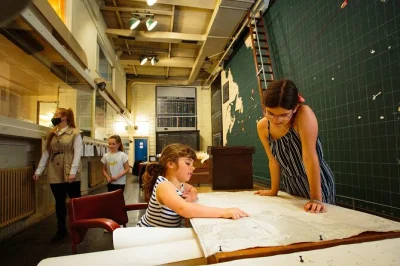 Step into liverpool’s western approaches bunker, explore wwii map rooms, touch real artifacts, and sip tea at wartime prices—includes entry with identity card.