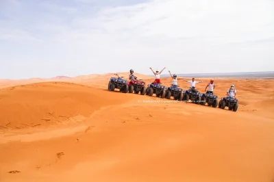 Ride an atv through merzouga’s sand dunes with a local guide. includes pickup, safety gear, and a visit to a nomad family. book your desert adventure now.