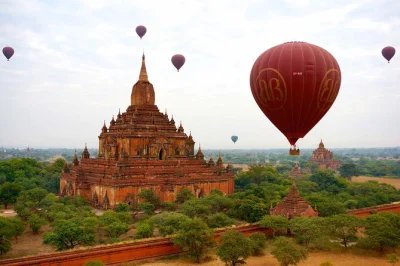 Float above bagan’s ancient temples at sunrise on a hot air balloon ride. includes hotel pickup, pre-flight coffee, and champagne breakfast after landing.