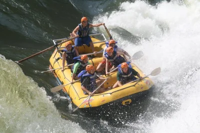 Experience white water rafting on the zambezi river below victoria falls, with hotel pickup, expert guides, and lunch included. book your adventure today.