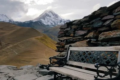 Travel from tbilisi to kazbegi with a local guide, stopping at mtskheta, ananuri fortress, and gergeti church. includes pickup, 4x4 ride, and lunch.