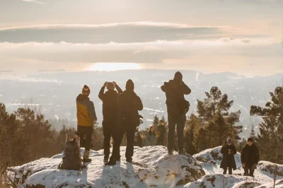 Walk through oslo’s snowy forests to vettakollen summit for sweeping oslofjord views. includes metro tickets and a local guide. book your winter hike now.